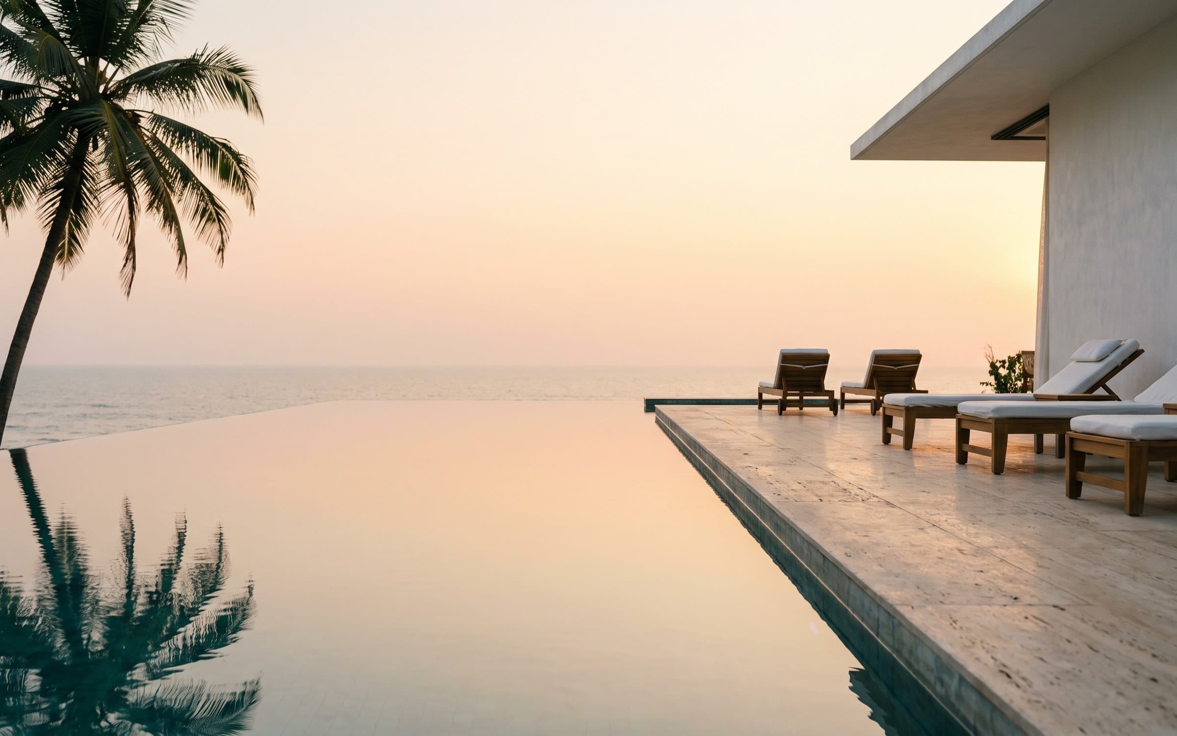The Arabian Sea horizon in gold, seen over the pool edge
